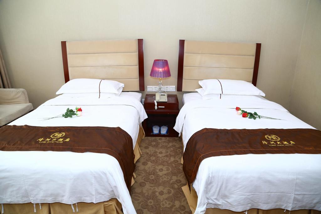 Long Zhou Grand Hotel Guangzhou Kamer foto
